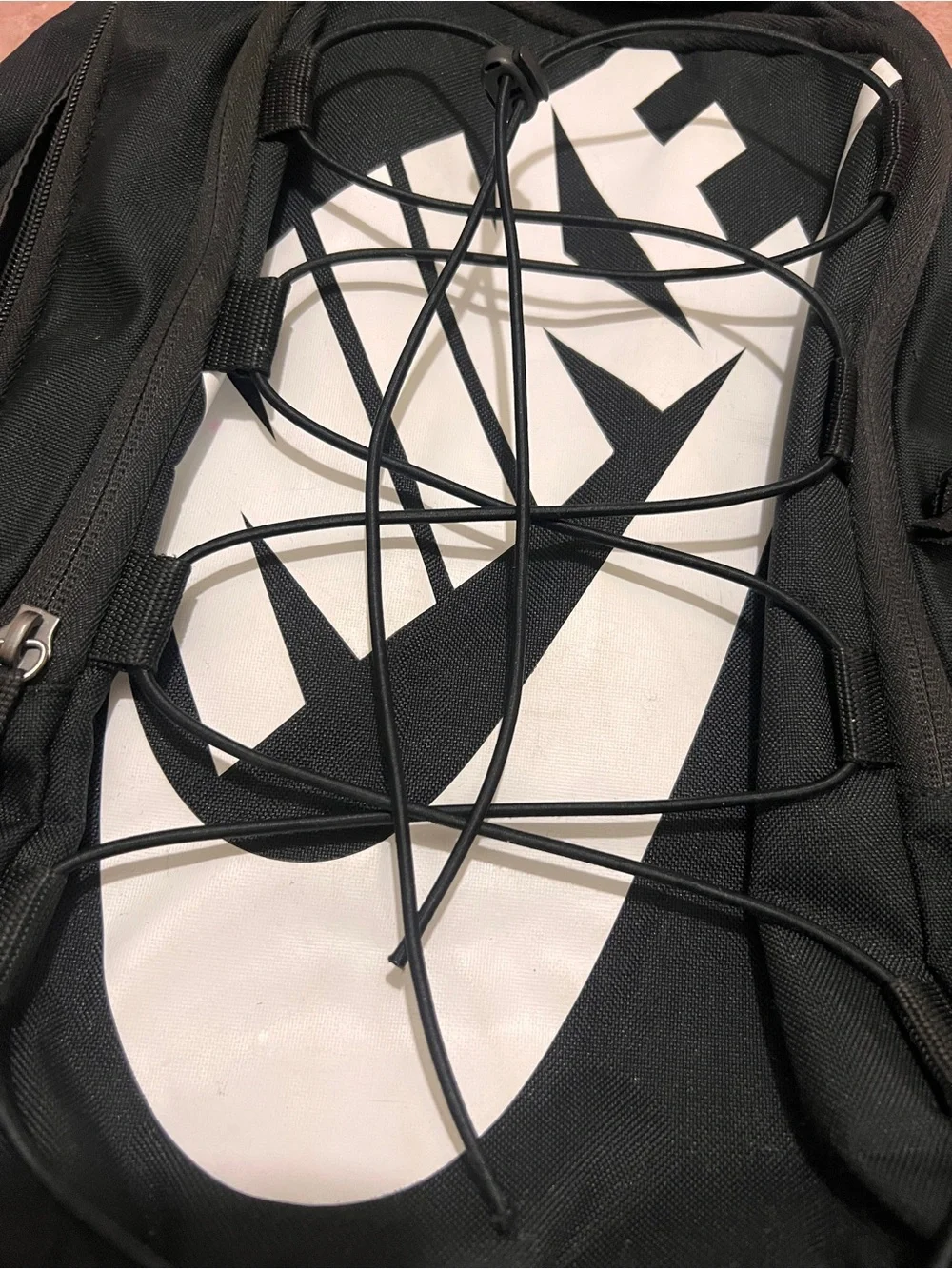 Nike Black Backpack with Large White Swoosh and Front Bungee